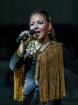 Odessa, Ukraine - February 16, 2019: Children's music groups singing and dancing on basketball court during a commercial break. Children's play. Emotional children's show on stage. Dancing on stageのeditorial素材