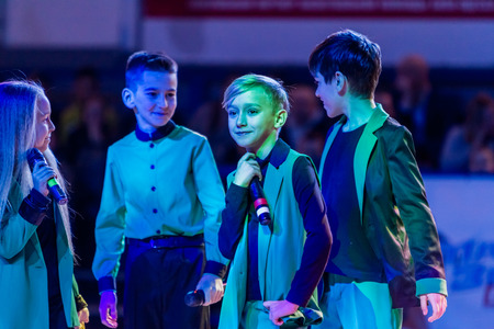 Odessa, Ukraine - February 16, 2019: Children's music groups singing and dancing on basketball court during a commercial break. Children's play. Emotional children's show on stage. Dancing on stageのeditorial素材