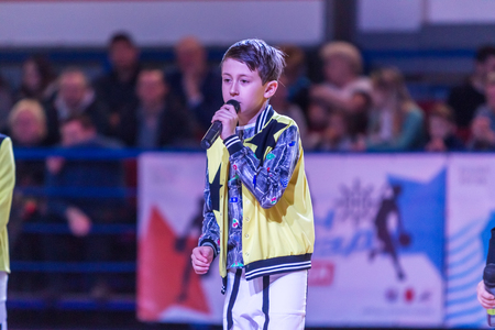Odessa, Ukraine - February 16, 2019: Children's music groups singing and dancing on basketball court during a commercial break. Children's play. Emotional children's show on stage. Dancing on stageのeditorial素材