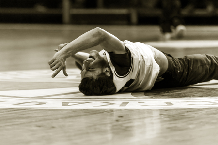 Odessa, Ukraine - February 16, 2019: street dancers, children and teenagers dance break dance on the basketball court during the commercial break. Hip-hop dancers perform at the sports arenaのeditorial素材