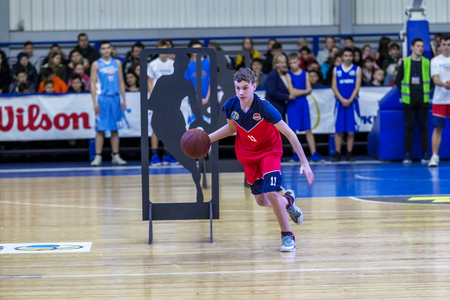Odessa, Ukraine - Feb. 16, 2019: Sporting holiday children's basketball school league. Teenagers play basketball, participate in children's sports competitions during celebration of children's clubのeditorial素材