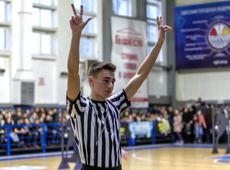 Odessa, Ukraine - February 16, 2019: A sports basketball referee oversees the battle of basketball...