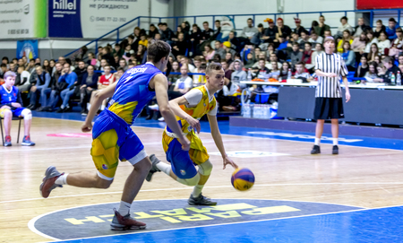 Odessa, Ukraine - Feb. 16, 2019: Sporting holiday children's basketball school league. Teenagers play basketball, participate in children's sports competitions during celebration of children's clubのeditorial素材