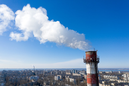 Air pollution, factory pipes, smoke from chimneys on sky background. Concept of industry, ecology,...