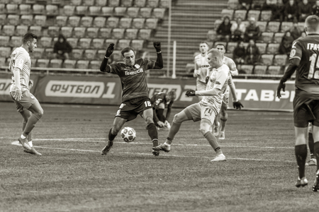 ODESSA, UKRAINE - March 2, 2019: football players of Shakhtar Donetsk - Chernomorets Odessa. Intensive game of the Premier League of Ukraineのeditorial素材