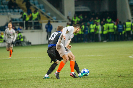 ODESSA, UKRAINE - March 2, 2019: football players of Shakhtar Donetsk - Chernomorets Odessa. Intensive game of the Premier League of Ukraineのeditorial素材