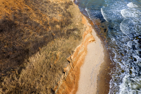 Mountain landslide in an environmentally hazardous area. Large crack in ground, descent of large layers of dirt. Deadly danger at foot of landslide mountain. Soil erosion Avalanche. Steep coast, crackの写真素材