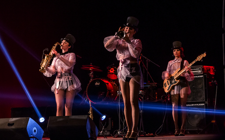 ODESSA, UKRAINE - MARCH 17, 2019: Bright music show FREEDOM JAZZ. Beautiful female jazz band on stage in a bright musical jazz show. Sexy women musicians on stage in an erotic musical performanceのeditorial素材