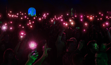ODESSA, UKRAINE - March 23, 2019: viewers in auditorium of concert hall emotionally meet their...