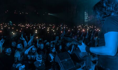 ODESSA, UKRAINE - March 23, 2019: viewers in auditorium of concert hall emotionally meet their...