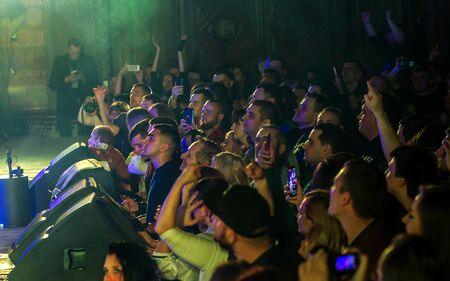 ODESSA, UKRAINE - March 23, 2019: viewers in auditorium of concert hall emotionally meet their...