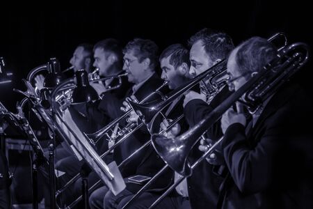 ODESSA, UKRAINE - March 23, 2019: Symphony orchestra concert on theater stage. Musicians of State Symphony Orchestra, instruments of symphony orchestra on stage. Score, sheet music during concertのeditorial素材