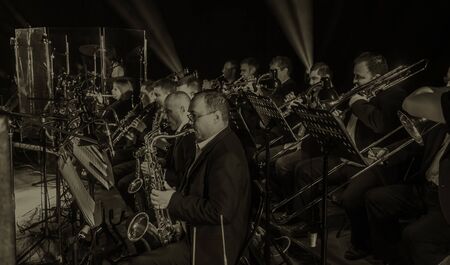 ODESSA, UKRAINE - March 23, 2019: Symphony orchestra concert on theater stage. Musicians of State Symphony Orchestra, instruments of symphony orchestra on stage. Score, sheet music during concertのeditorial素材