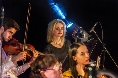 ODESSA, UKRAINE - March 23, 2019: Symphony orchestra concert on theater stage. Musicians of State...