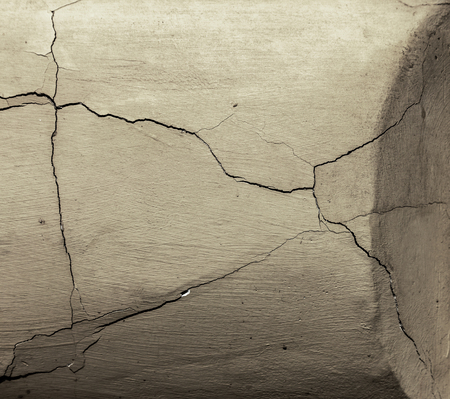 Vintage Cracks background. Background surface with creative cracks. Web cracks as background for creative design for layout. stone surface of cement layer with network is texture of deep cracksの写真素材