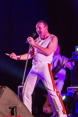 ODESSA, UKRAINE - MARCH 16, 2019: Rock concert Queen tribute show, Bohemian night of the Queen. Rock band copies the performance of the legendary Freddy Merqury group Queen. Rock concert Queenのeditorial素材