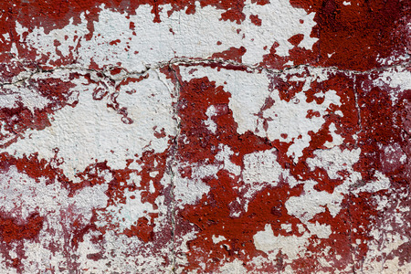 Empty old art texture of plaster brick wall. Painted bad scratched surface in fissures of painted stucco of stone brick wall with petal texture. rubbed facade of building with damaged plasterの写真素材