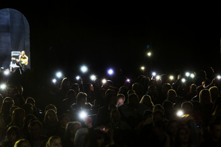 Odessa, Ukraine - April 8, 2019: crowd of spectators at rock concert by ALOSHA during music show....