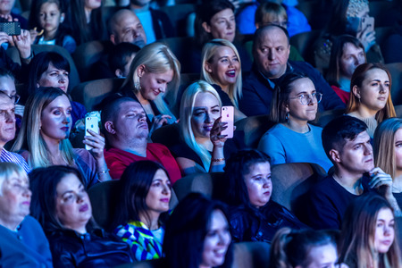 Odessa, Ukraine - April 12, 2019: Crowd of spectators at rock concert ALEKSEEV during music show. Crowds of happy people enjoy rock concert, raise their hands and clap their hands, audience on podiumのeditorial素材