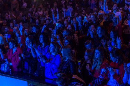 Odessa, Ukraine - April 12, 2019: Crowd of spectators at rock concert ALEKSEEV during music show....