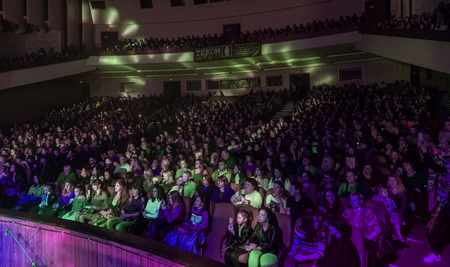 Odessa, Ukraine - April 12, 2019: Crowd of spectators at rock concert ALEKSEEV during music show. Crowds of happy people enjoy rock concert, raise their hands and clap their hands, audience on podiumのeditorial素材