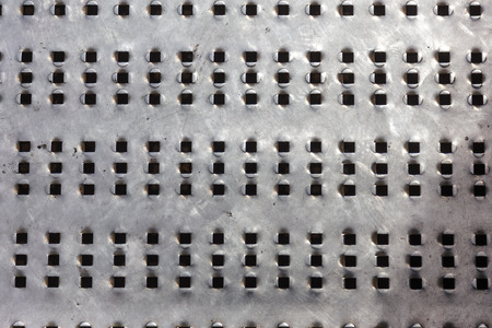 Grunge metal background or texture with scratches and cracks. Background metal surface made of stainless steel. Old, dirty scratched stainless steel floor plate texture. Free space. Selective focusの写真素材