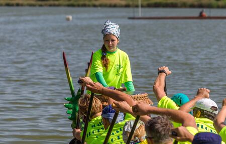 Odessa, Ukraine - June 2, 2019: Dragon Boat Racing during Dragon Boat Festival, DragBoat Racing is popular traditional Chinese water sport. Dragboat on river. People rowing oars in summer raceのeditorial素材