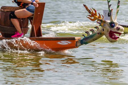 Odessa, Ukraine - June 2, 2019: Dragon Boat Racing during Dragon Boat Festival, DragBoat Racing is popular traditional Chinese water sport. Dragboat on river. People rowing oars in summer raceのeditorial素材