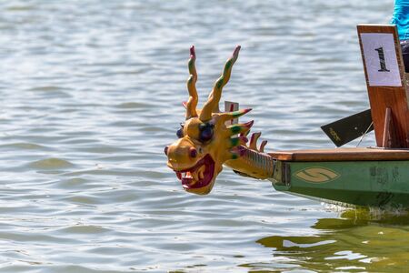Odessa, Ukraine - June 2, 2019: Dragon Boat Racing during Dragon Boat Festival, DragBoat Racing is popular traditional Chinese water sport. Dragboat on river. People rowing oars in summer raceのeditorial素材