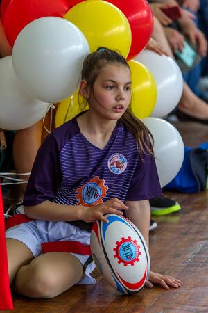 ODESSA, UKRAINE - MAY 18, 2019: Young children play rugby during final games of championship in hall. Children's sport. Children play rugby 5. Fight for victory of children in rugbyのeditorial素材