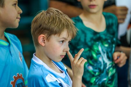 ODESSA, UKRAINE - May 18, 2019. Spectators, fans in stands of gym are emotionally supported by team of children's rugby championship 5. Parents and children are having fun enjoying rugby tournamentのeditorial素材