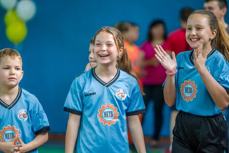 ODESSA, UKRAINE - MAY18, 2019: Young children play rugby during final championship games in hall....