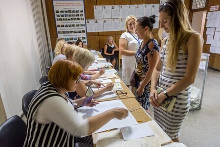 ODESSA, UKRAINE - July 21, 2019: elections in Ukraine. Place for people voting by voters in national political elections to parliament of Ukraine. Ballot box for voters. Electorate at polling stationのeditorial素材