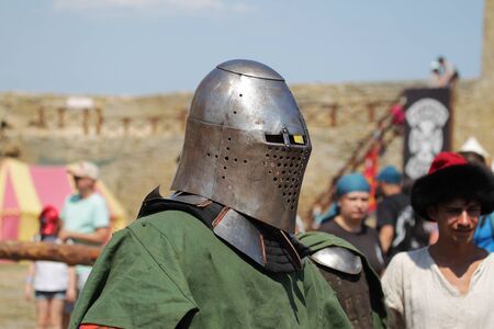 ODESSA, UKRAINE - JULY 20, 2019: Battle of the Knights with medieval weapons at the medieval performance. Knights fight on the field during the battle tournament of the festival of medieval cultureのeditorial素材