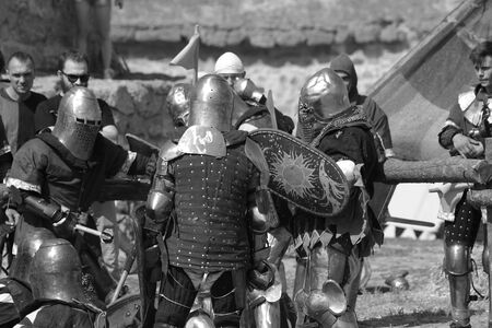 ODESSA, UKRAINE - JULY 20, 2019: Battle of the Knights with medieval weapons at the medieval performance. Knights fight on the field during the battle tournament of the festival of medieval cultureのeditorial素材