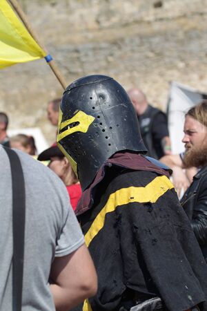 ODESSA, UKRAINE - JULY 20, 2019: Battle of the Knights with medieval weapons at the medieval performance. Knights fight on the field during the battle tournament of the festival of medieval cultureのeditorial素材