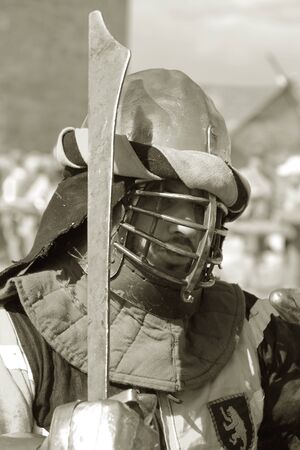 ODESSA, UKRAINE - JULY 20, 2019: Battle of the Knights with medieval weapons at the medieval performance. Knights fight on the field during the battle tournament of the festival of medieval cultureのeditorial素材