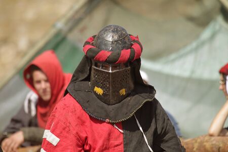 ODESSA, UKRAINE - JULY 20, 2019: Battle of the Knights with medieval weapons at the medieval performance. Knights fight on the field during the battle tournament of the festival of medieval cultureのeditorial素材