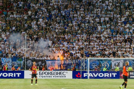 ODESSA UKRAINE - July 28, 2019: spectators at stadium. Crowds of fans in stands of football stadium during match Shakhtar (Donetsk) -Dynamo (Kiev). Grandstand with fans. Stands with football fansのeditorial素材