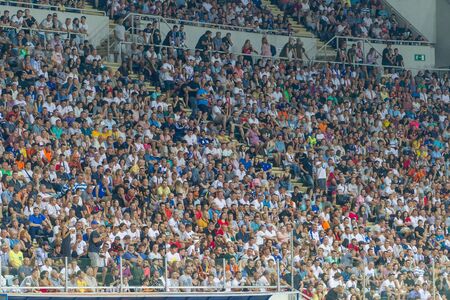 ODESSA UKRAINE - July 28, 2019: spectators at stadium. Crowds of fans in stands of football stadium during match Shakhtar (Donetsk) -Dynamo (Kiev). Grandstand with fans. Stands with football fansのeditorial素材