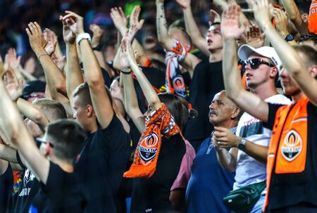 ODESSA UKRAINE - July 28, 2019: spectators at stadium. Crowds of fans in stands of football stadium during match Shakhtar (Donetsk) -Dynamo (Kiev). Grandstand with fans. Stands with football fansのeditorial素材