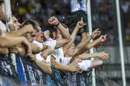 ODESSA UKRAINE - July 28, 2019: spectators at stadium. Crowds of fans in stands of football stadium during match Shakhtar (Donetsk) -Dynamo (Kiev). Grandstand with fans. Stands with football fansのeditorial素材