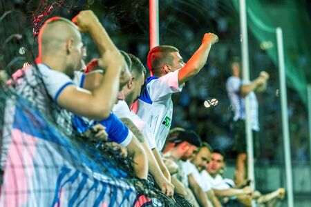 ODESSA UKRAINE - July 28, 2019: spectators at stadium. Crowds of fans in stands of football stadium...