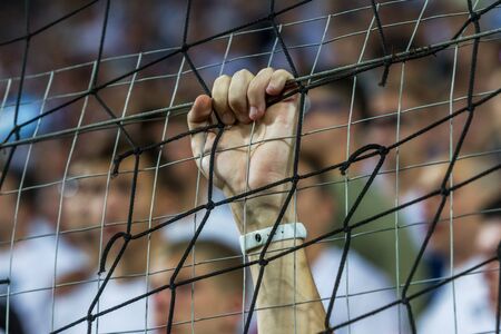 ODESSA UKRAINE - July 28, 2019: spectators at the stadium. Crowds of fans in the stands of a football stadium during the match Shakhtar (Donetsk)-Dynamo (Kiev). Grandstand with fans. Stands with football fansのeditorial素材