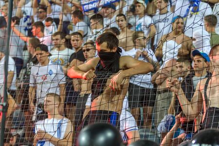 ODESSA UKRAINE - July 28, 2019: spectators at the stadium. Crowds of fans in the stands of a football stadium during the match Shakhtar (Donetsk)-Dynamo (Kiev). Grandstand with fans. Stands with football fansのeditorial素材