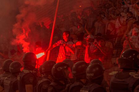 ODESSA, UKRAINE -July28,2019: Fanatical fans in stand during game of eternal rivals. Fans on racks...