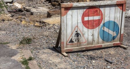 Large cracks, chips. Broken asphalt shifted landslide after flood. Destroyed road by water. Groundwater flushing. Concept of destruction of roads from nature. Consequences of flood. Broken  streetの写真素材