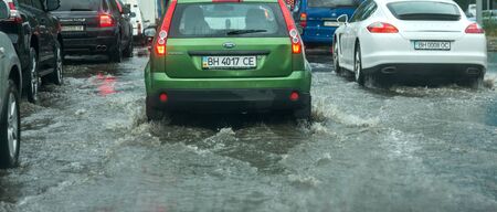 Odessa, Ukraine -August 9,2019: driving car on flooded road during flood caused by torrential rains....