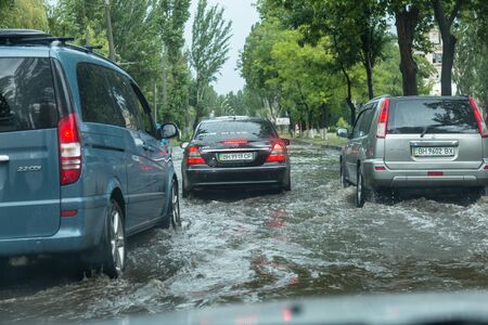 Odessa, Ukraine -August 9,2019: driving car on flooded road during flood caused by torrential rains....