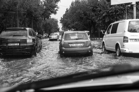 Odessa, Ukraine -August 9,2019: driving car on flooded road during flood caused by torrential rains....